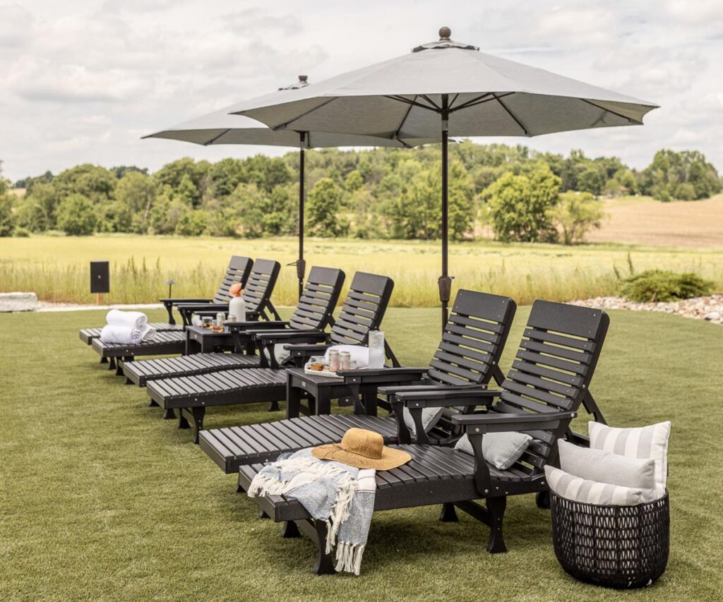 Black brown lounge chairs with umbrellas