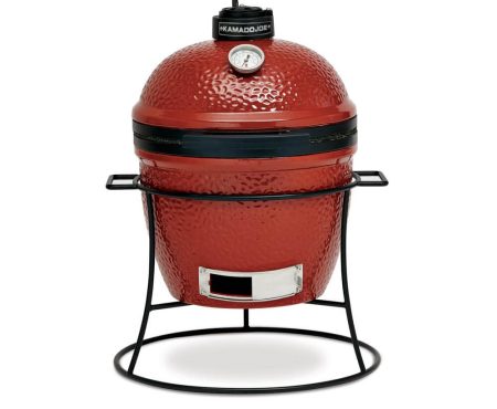 Kamado Joe Grills Joe Jr.® grill With Cast Iron Stand,Inside view of the Joe Jr.® grill,Slo Roller cooking grate,covered girl beside a lounge chair,Ceramic Soapstone,Table that holds a grill